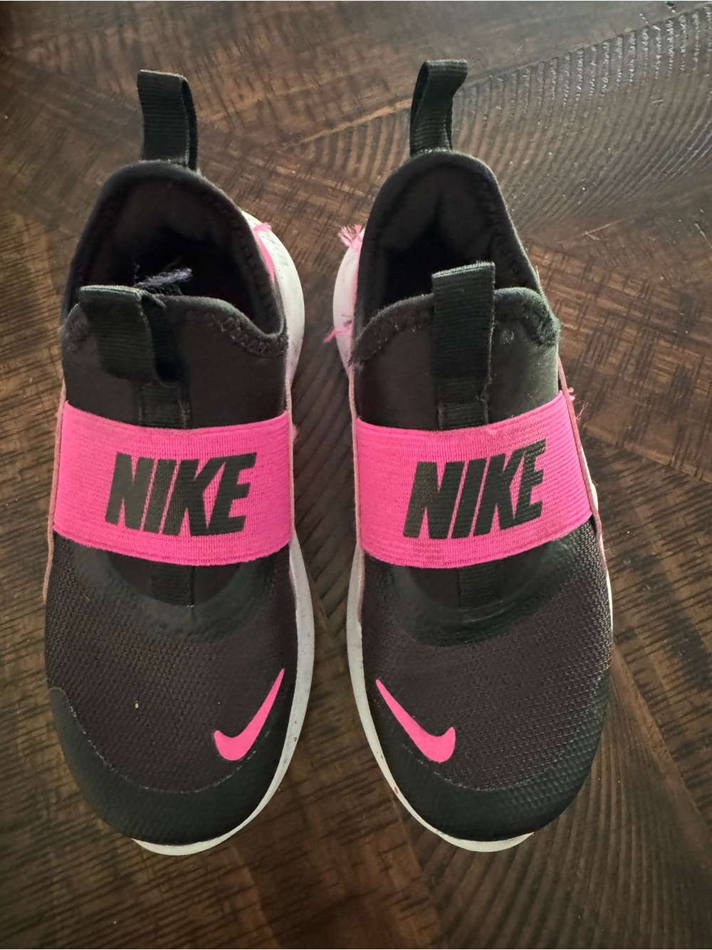 Nike Kids Black Slip-On Sneakers with Pink Accents